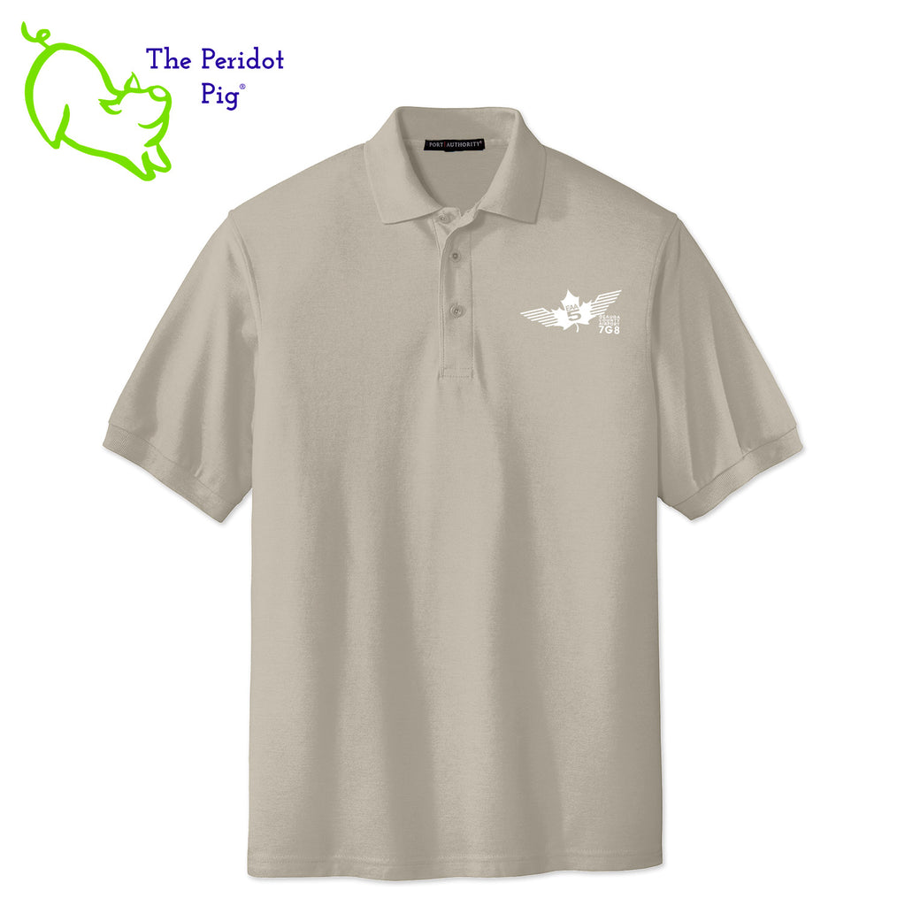 Renowned for its resilience, our incomparably comfortable classic polo is second to none. Expertly designed to resist wrinkles and shrinkage, this must-have polo delivers a luxuriously soft feel. Featuring the iconic EAA Chapter 5 logo on the left chest, you won't ever regret choosing this timeless piece. Front view shown in Stone-White.