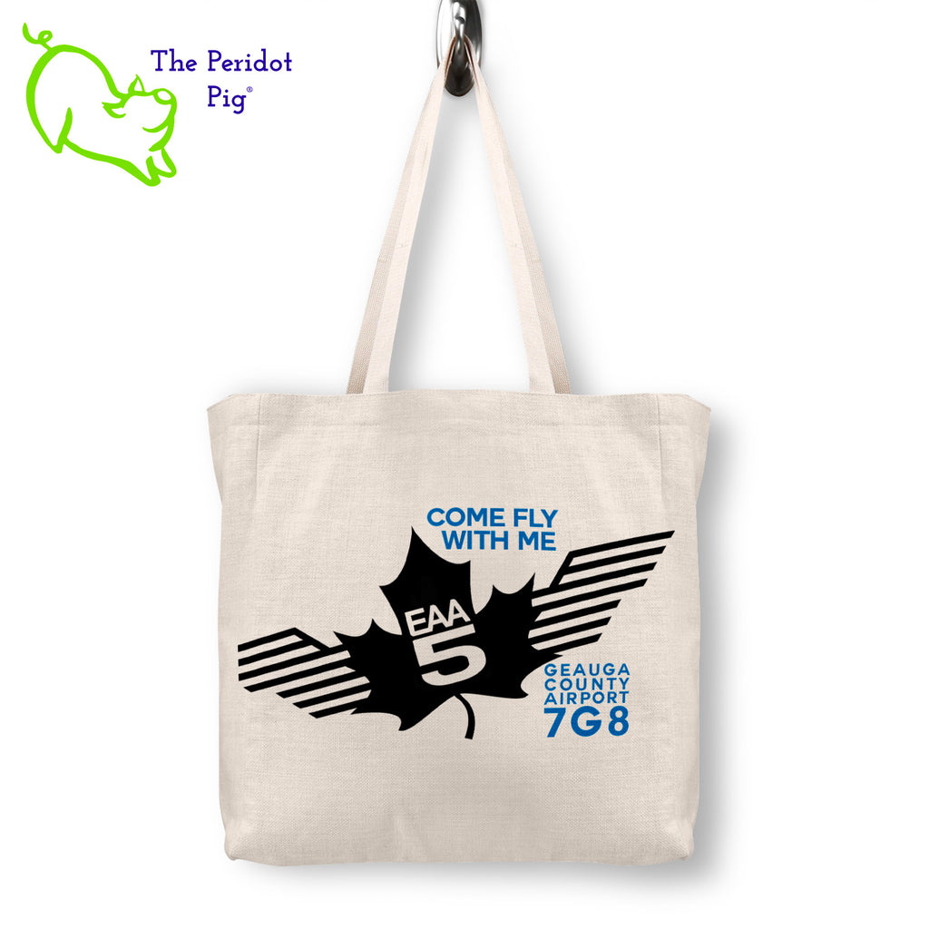 Step out in style with the stylish, spacious EAA Chapter 5 Come Fly With Me Logo Tote-- designed with a sublimated print that won't wear away, and a vivid logo on the front. The back side is left blank for a polished look. Perfect for carrying around everything you need in sturdy, long-lasting fashion. Front view shown.