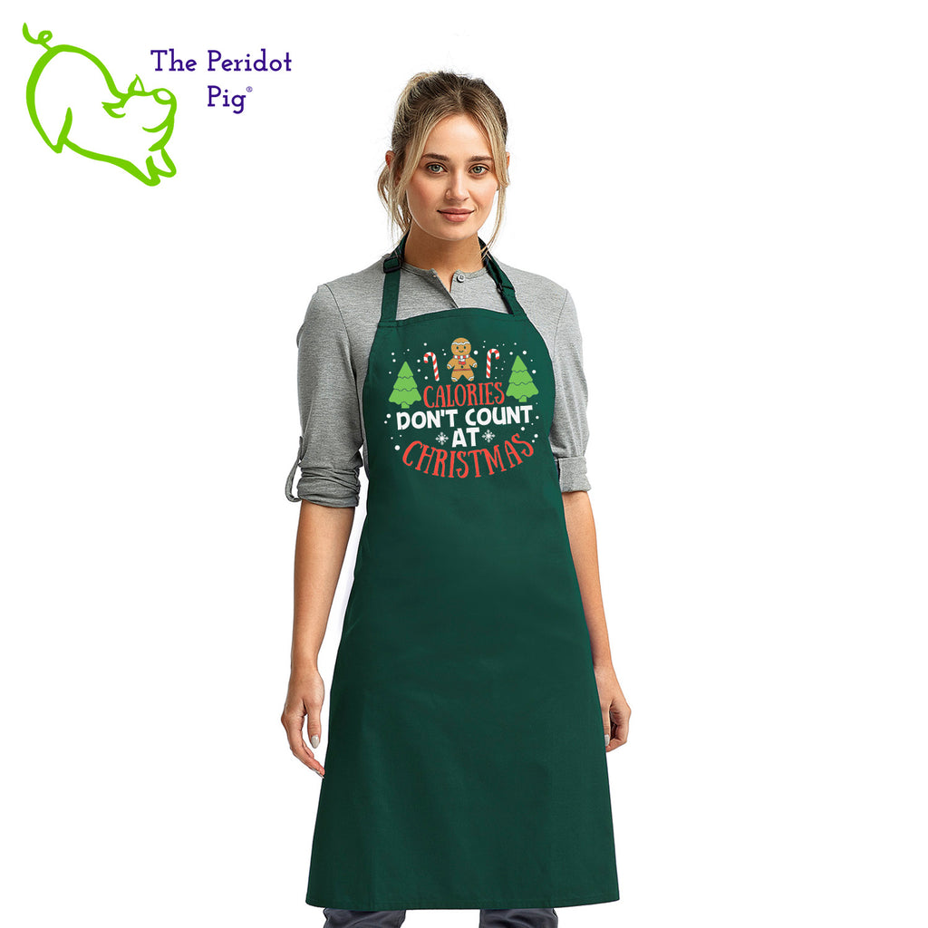 Calories don't count for free food and at Christmas. That's my story and I'm sticking to it! If you abide by this rule, here's the perfect apron for you.  The front says, "Calories don't count at Christmas" in bright festive colors. There are trees, candy canes, a gingerbread man and snow flakes to round out the design. Front view shown in Green.