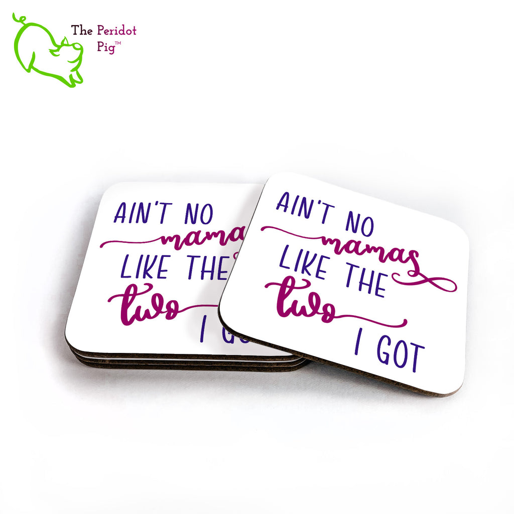 Show your pride for the wonderful mothers you have! This set of four square coasters is printed in bright colors on either a matte or a gloss coaster. They simply state that "Ain't no mamas like the two I got" in bright purple colors. Shown in a stack with one to the right.