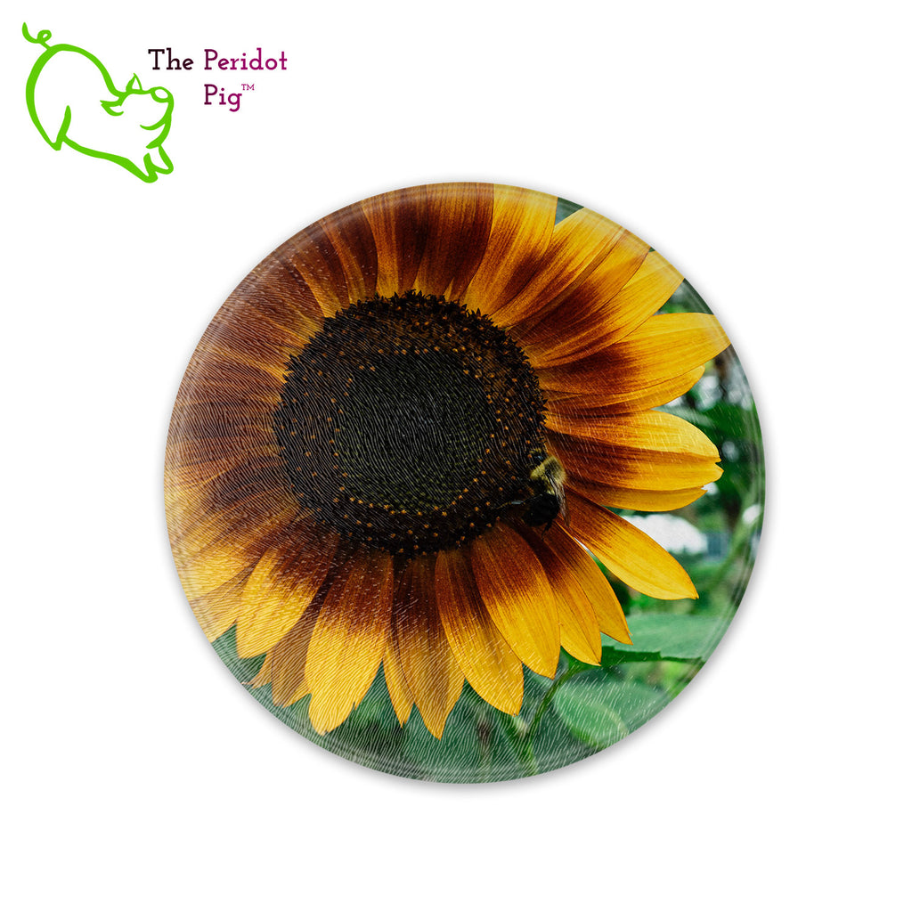 This beautiful tempered glass cutting board is a wonderful keepsake!  This one features a bright yellow sunflower with a cute little honey bee in a vivid and detailed print. Perfect for cutting or using as a serving board! Front view.