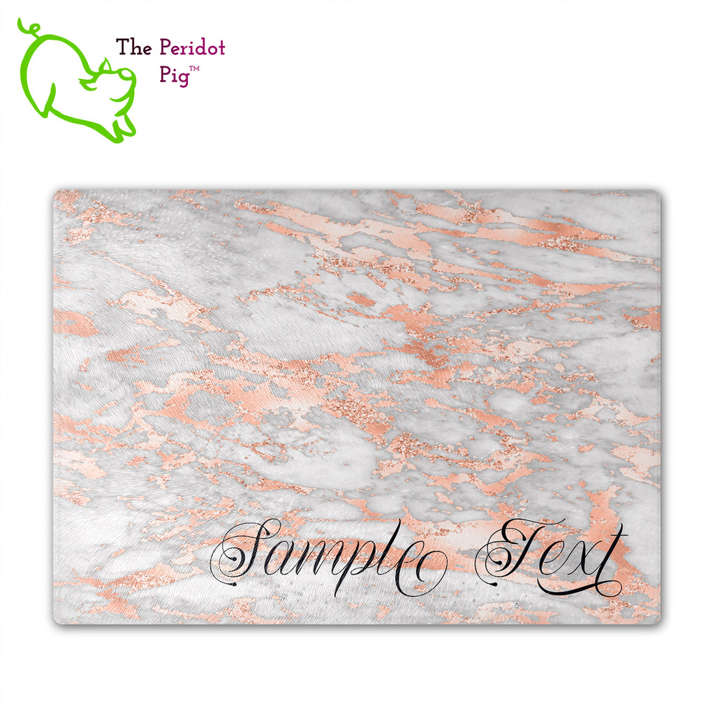 These beautiful tempered glass cutting boards are a wonderful keepsake!  They can be personalized with names, quotes or dates. These feature swirling marbles in rose gold and glitter foil in a vivid and detailed print. We prefer a scrolling script for the personalization in this design. There is also a little bling under the name included too. Front view with sample text. Style B