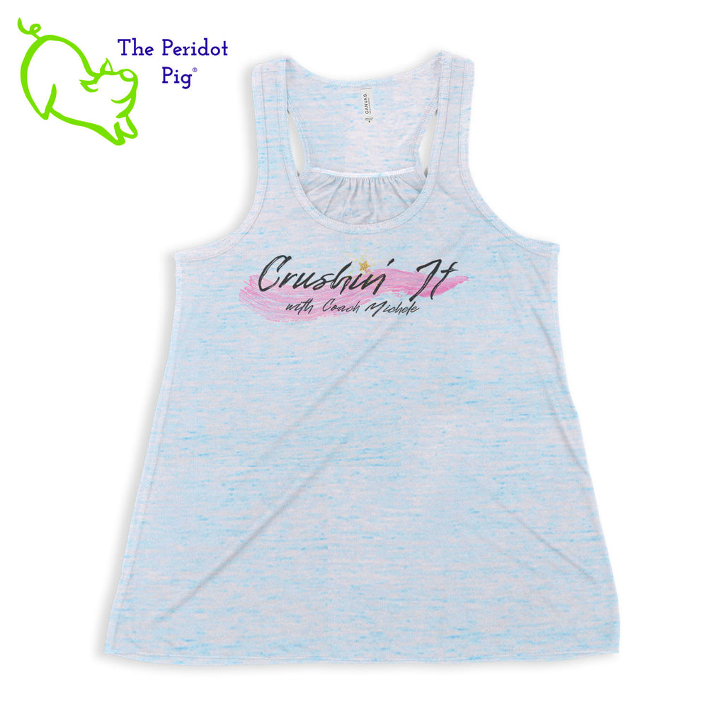 The front features Coach Michele Smits' Crushin' It! logo and the back is blank. There's also a small gold, glitter star over the "i" because everyone needs a little sparkle! The print will be in a "vintage" look that is slightly faded on the white, pink and athletic heather versions. On the marble colors, the print is a little more vivid. Front view in Blue Marble.