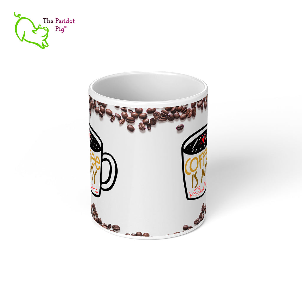 Who needs people when you have coffee?? This 11 oz coffee mug is the perfect gift for the coffee lover in your life. The printed saying states, "Coffee is my valentine" nestled amongst a field of coffee beans. Center view.