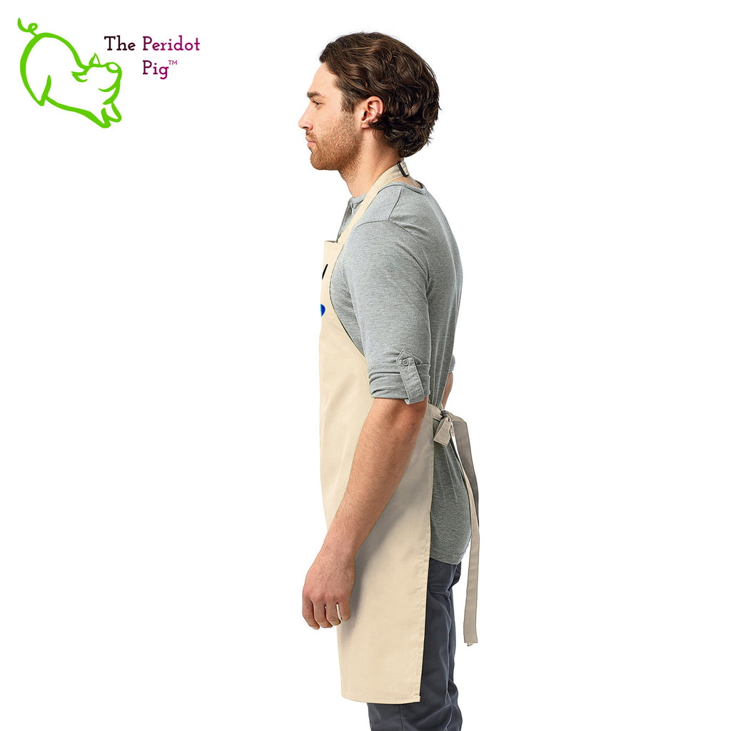 This lovely apron has a printed graphic that states "Season everything with love" on the front with a little rainbow heart. Perfect gift during Pride month or any day for that matter! Side view shown in Natural.