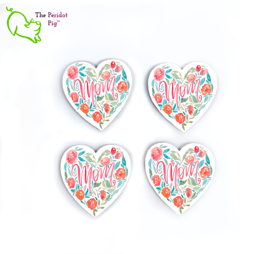 This lovely set of four heart-shaped coasters is the perfect gift for Mom. Each is printed with a floral heart wreath with the word, Mom, in the center. The coasters are printed in a durable ink that won't fade over time. Showing four side by side.