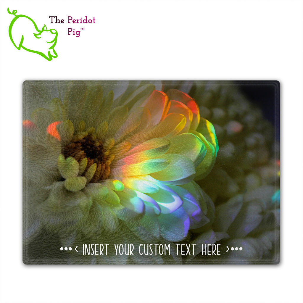 These beautiful tempered glass cutting boards are a wonderful keepsake!  They can be personalized with names, quotes or dates. This one features a large white chrysanthemum with a refracted rainbow splashed across it in a vivid and detailed print. Front view without the highlights.