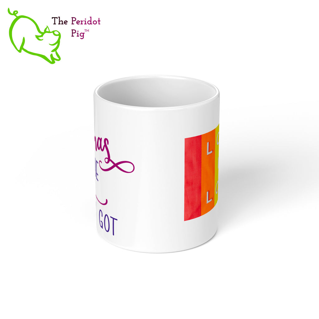 A shout out to our LGTQB Moms! Celebrate Mother's day with a gift that embraces your pride. The mug says, "Ain't no mamas like the two I got" on the front. On the back, it has rainbow stripes with the saying, "Love is love". Center view.