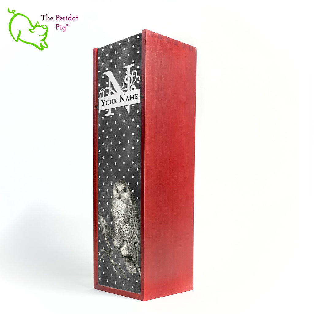 The wine box front panel is decorated in a glossy, detailed print with a white monogram and space for a customized name. This model has a smokey dark gray background with a pattern of white dots. In the foreground is a large black line drawing of an owl. Cherry version front view.