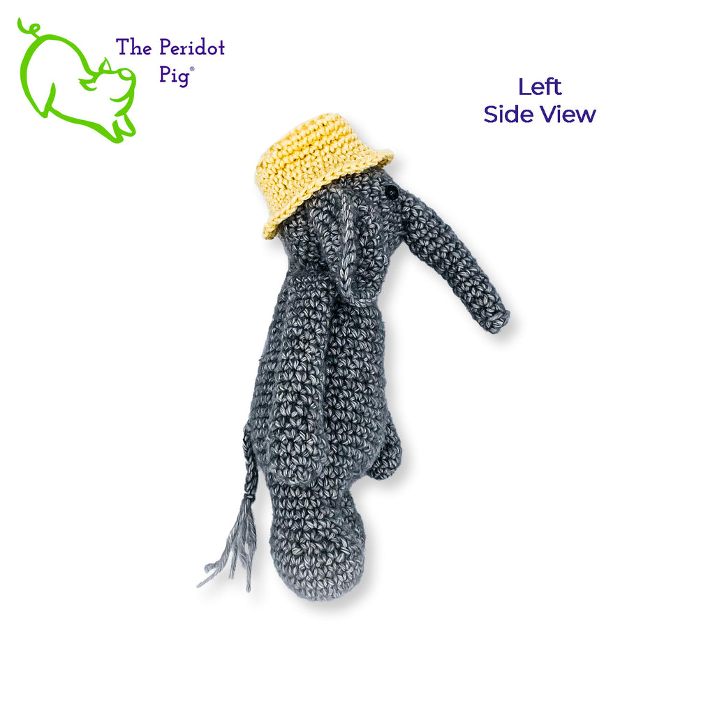 Ollie is sporting a little yellow, dad hat. We really think all elephants should wear a bucket hat. It really becomes him! He's hand crocheted out of a soft cotton/acrylic blend and will last a lifetime. His cute little hat is tacked on so it won't get lost. Left side view shown.
