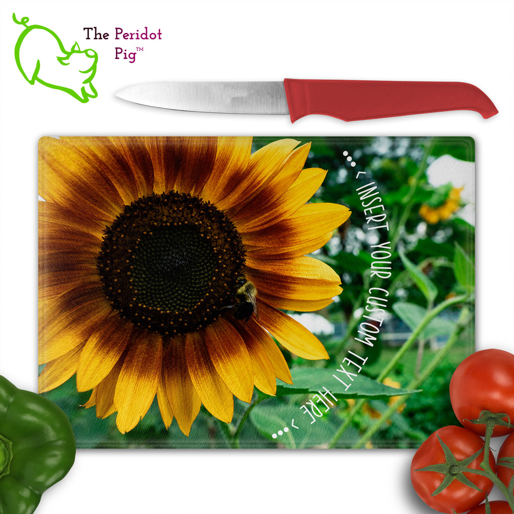 These beautiful tempered glass cutting boards are a wonderful keepsake!  They can be personalized with names, quotes or dates. This one features a huge sunflower with a little honey bee in a vivid and detailed print. The text can wrap around as shown or be formatted in a block if longer. Front view shown with cutlery.