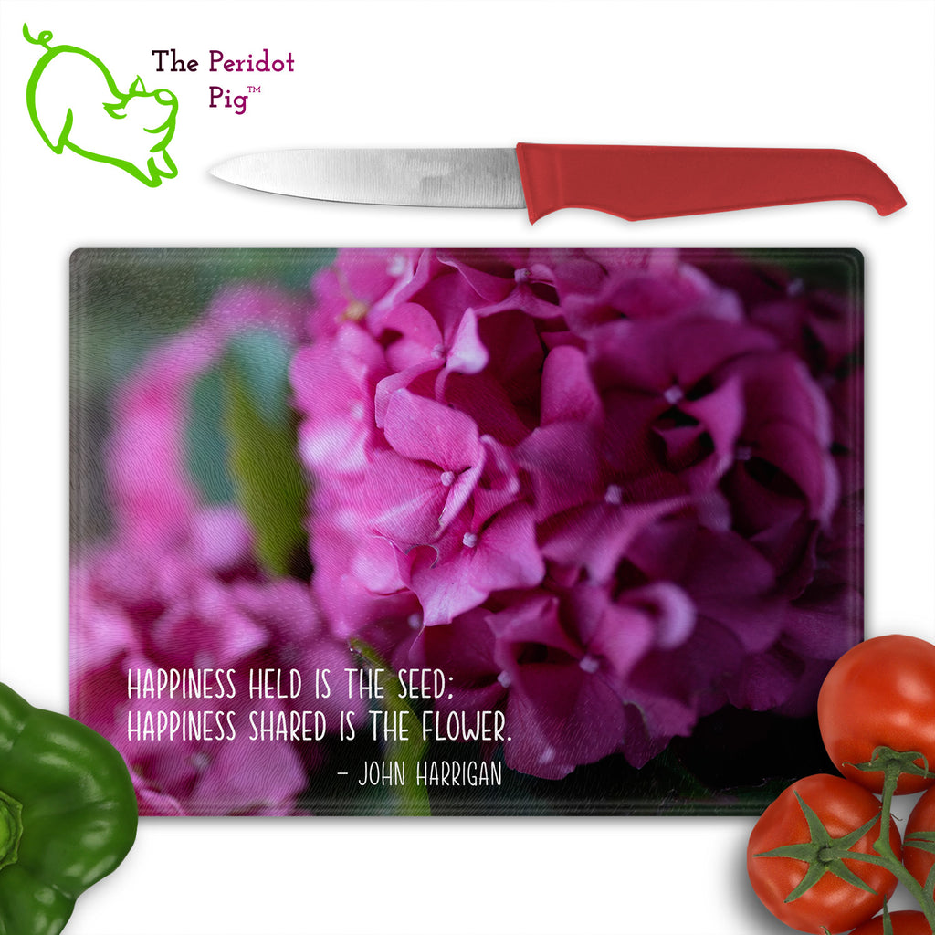 These beautiful tempered glass cutting boards are a wonderful keepsake!  They can be personalized with names, quotes or dates. This one features bright purple pink hydrangeas in a vivid and detailed print. Perfect for cutting or using as a serving board! Fron view shown with cutlery.