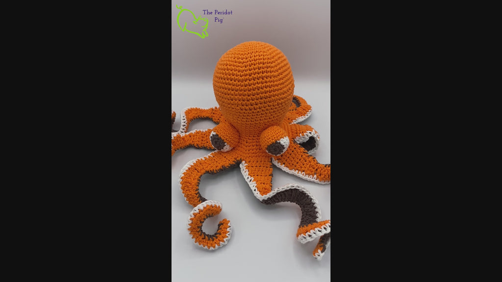 My husband thought an octopus only comes in black but we begged to differ! The North Pacific Giant Octopus come is a lovely shade of orange like our Olivia. At first glance, she's a bit intimidating but in reality, she is soft and cuddly. Olivia is made from sturdy cotton and is meant to last a life-time. Video view shown.