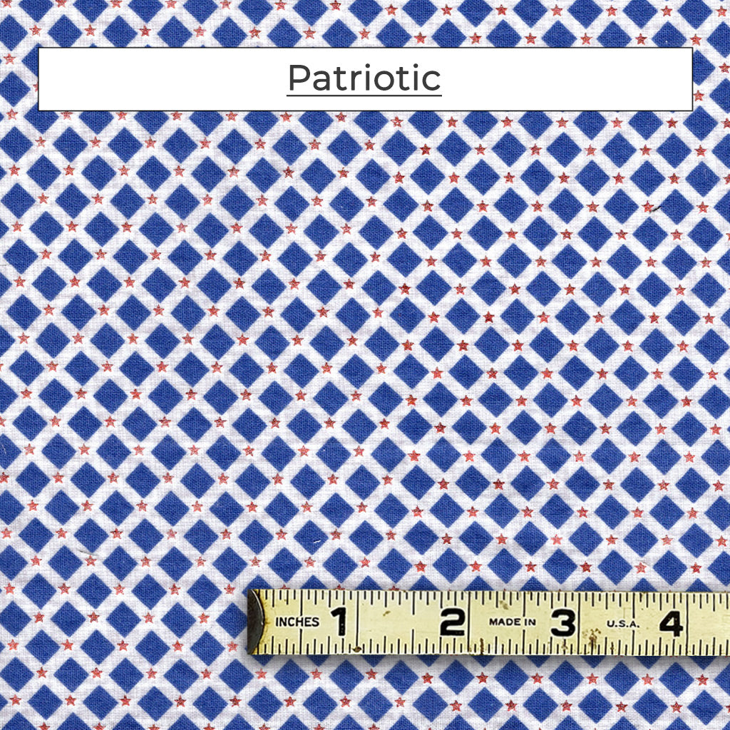 Fabric pattern with blue diamonds on a white background with small red foil stars.  Called Patriotic