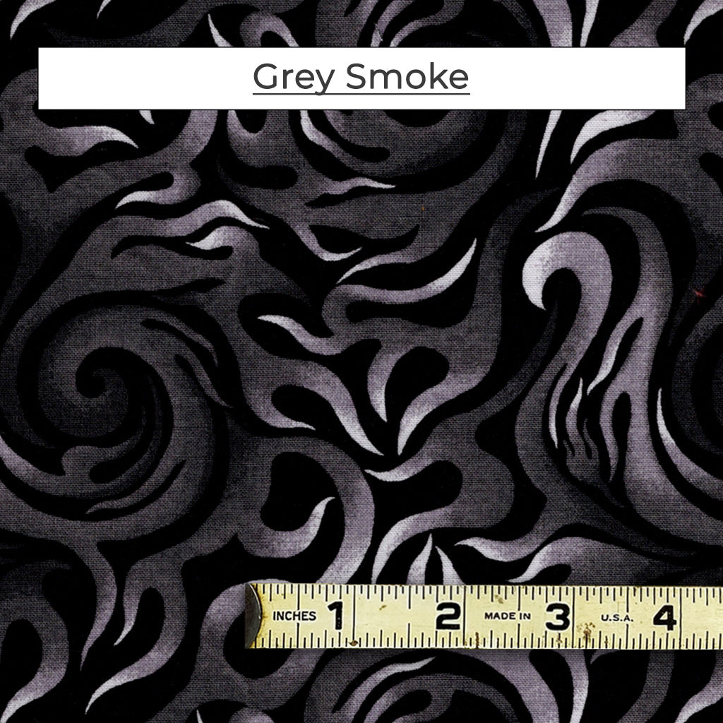 A mixed color fabric with grey and white smoke/flames on a black background. Called Grey Smoke