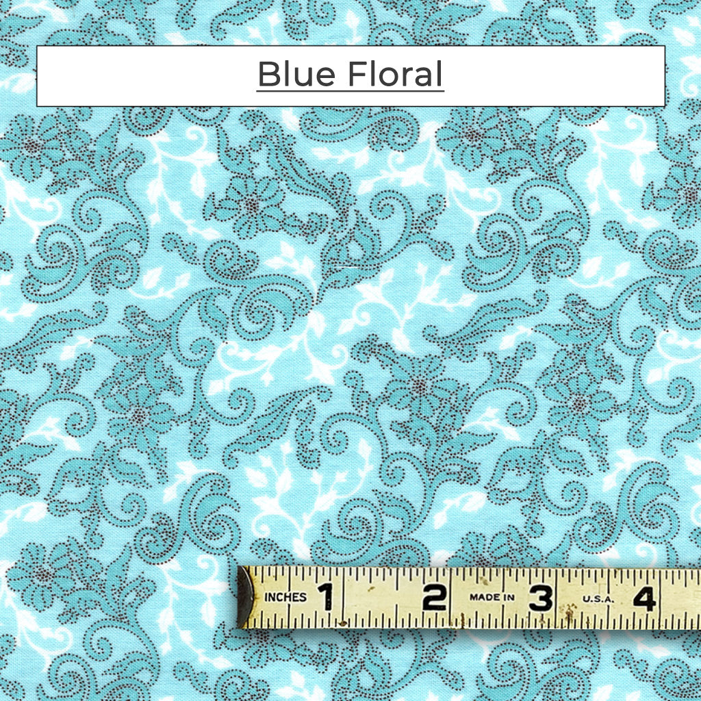 Delicate scrolling vines with flowers set on a light blue and white background. This fabric makes us want to shop at Tiffany's! Called Blue Floral.