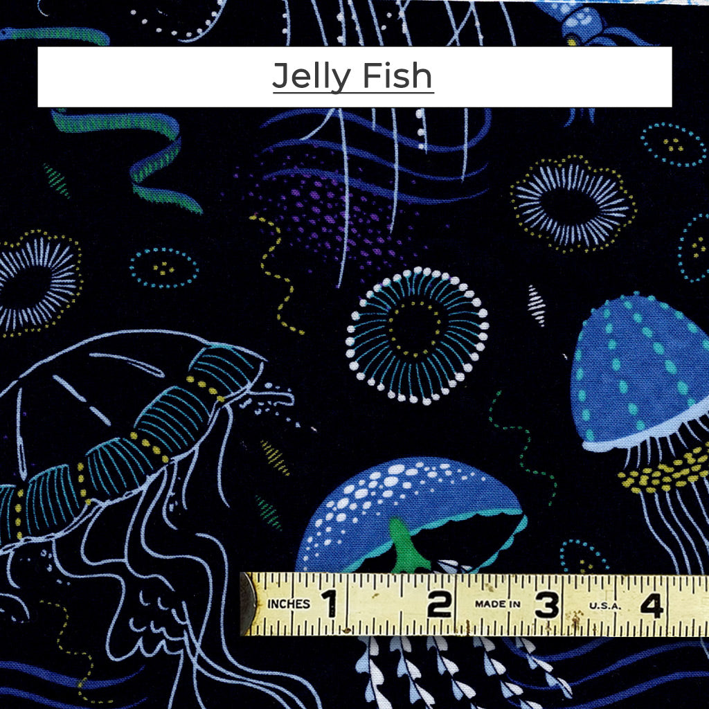 This print has delicate jelly fish on a deep blue background.