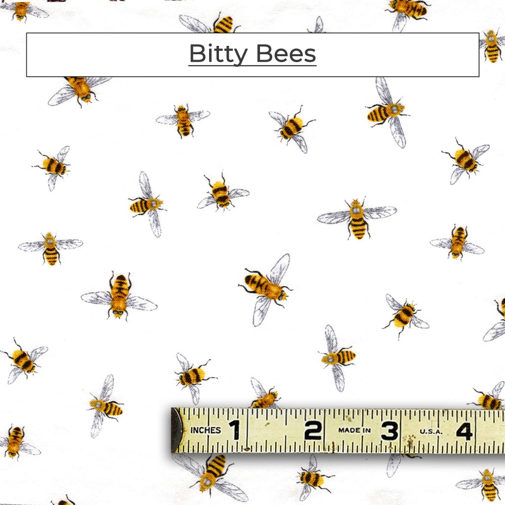 Tiny little bees on a white background fabric pattern called Bitty Bees.