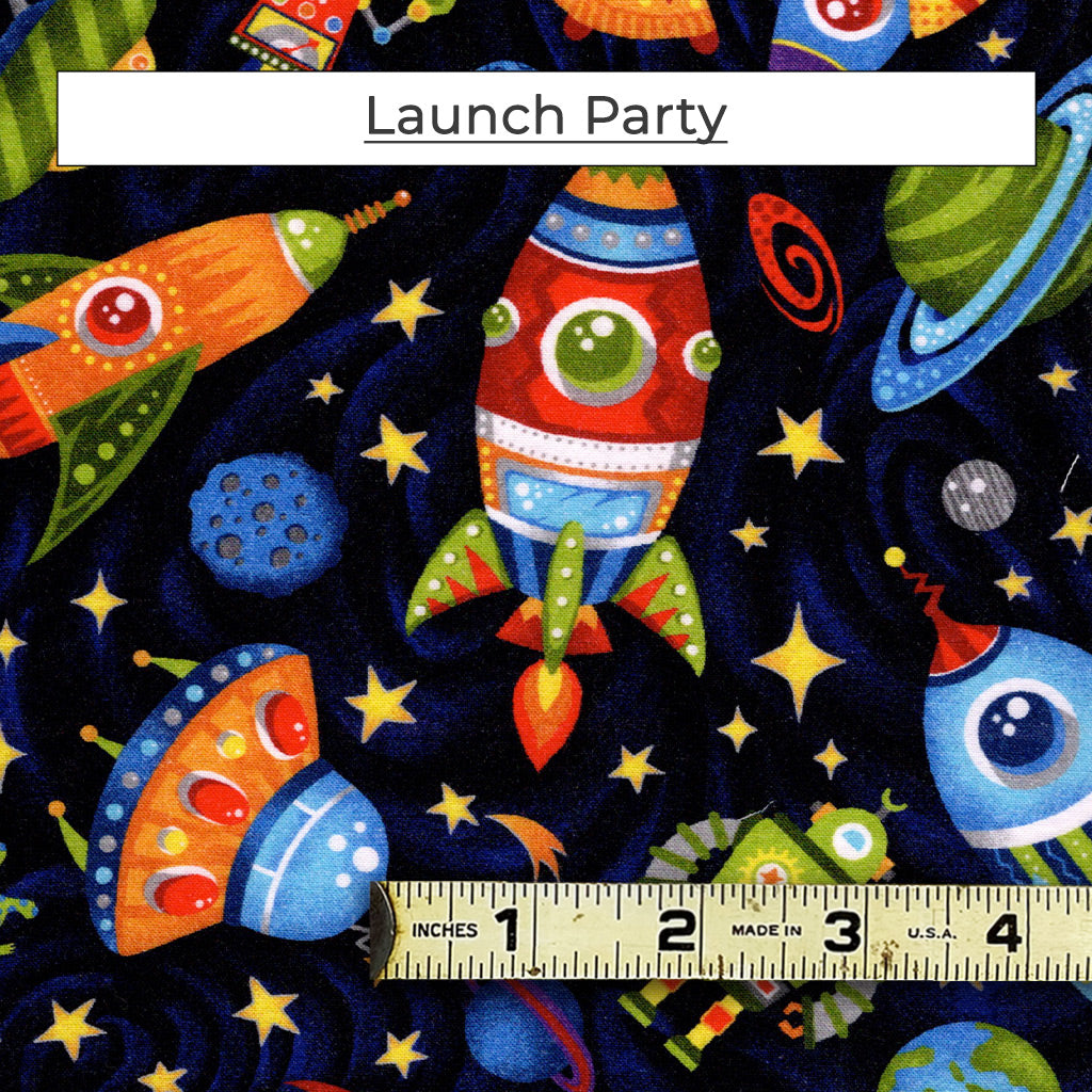 The Launch Party fabric pattern features rockets, planets, UFOs and cranky robots on a black star filled background.