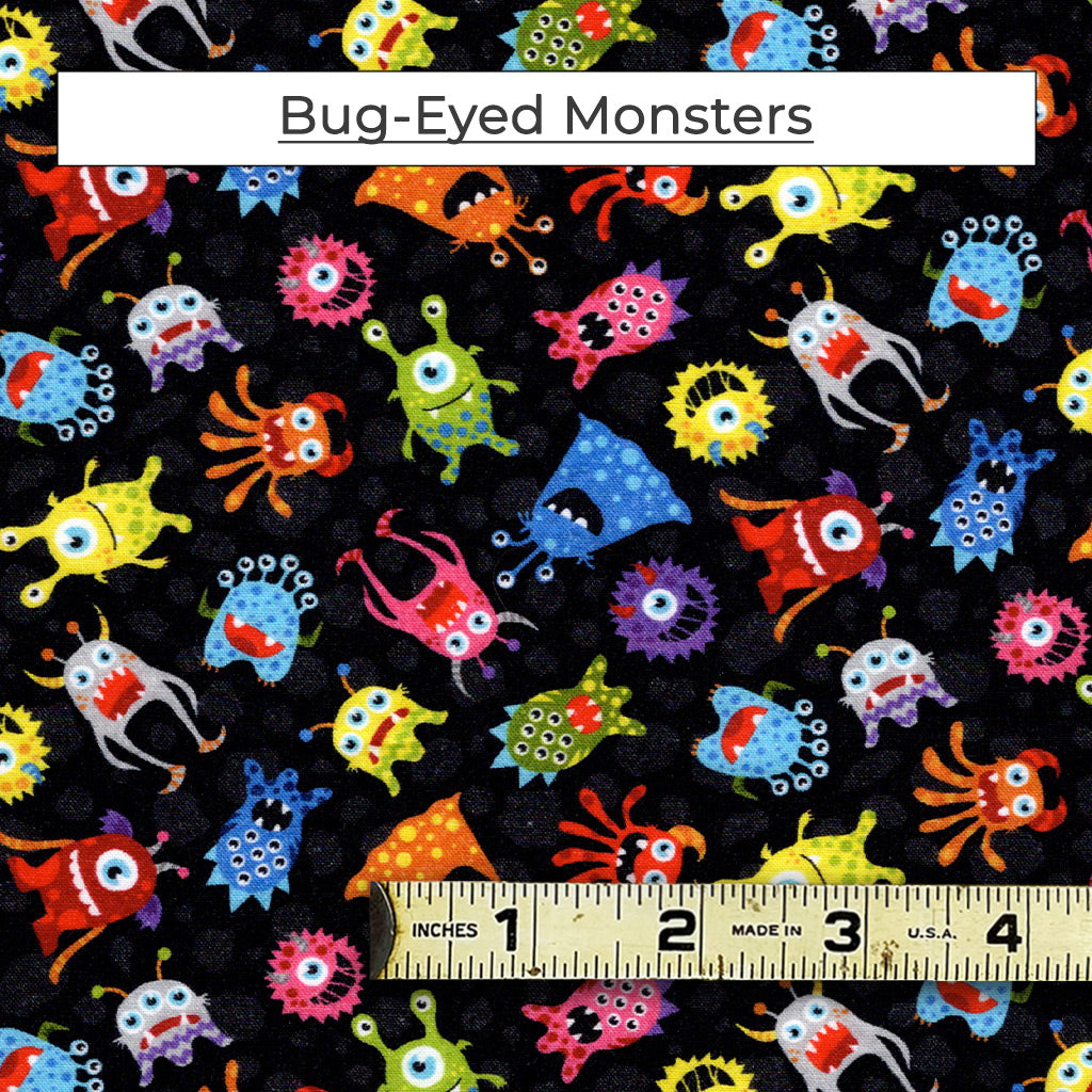 The Bug-Eyed Monsters fabric has a bunch of colorful BEMS floating in space. A colorful print on a black background. 