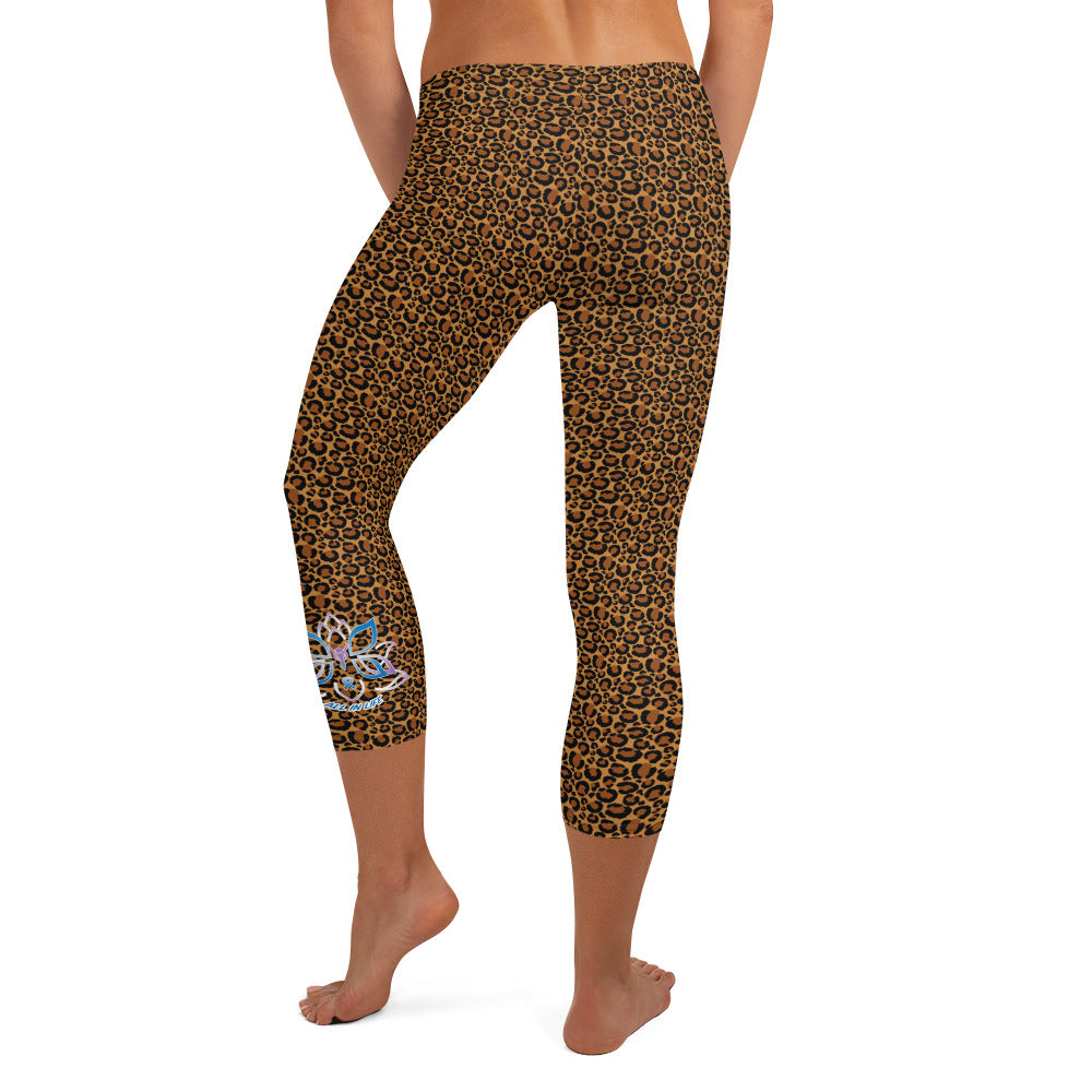 Kristin Zako embodies the "Wild & Free" spirit of her print capri leggings. These are printed in vivid color with a stylized cheetah print. The words, "WILD & FREE" are down the right leg and you'll find Kristin's logo on the lower left leg. Leopard style - back view.