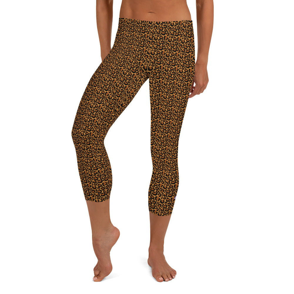 Kristin Zako embodies the "Wild & Free" spirit of her print capri leggings. These are printed in vivid color with a stylized cheetah print. The words, "WILD & FREE" are down the right leg and you'll find Kristin's logo on the lower left leg. Leopard style - Front view.
