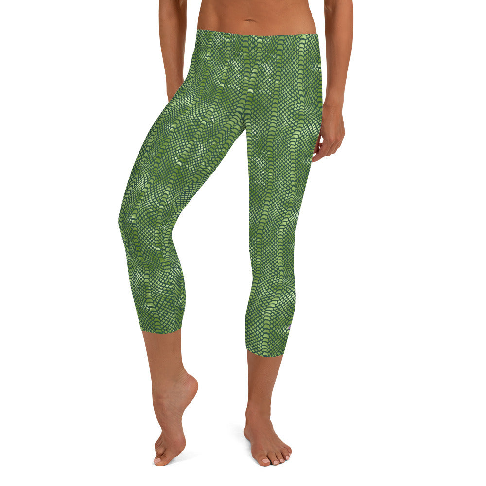 Kristin Zako embodies the "Wild & Free" spirit of her print capri leggings. These are printed in vivid color with a stylized cheetah print. The words, "WILD & FREE" are down the right leg and you'll find Kristin's logo on the lower left leg. Crocodile style - front view.