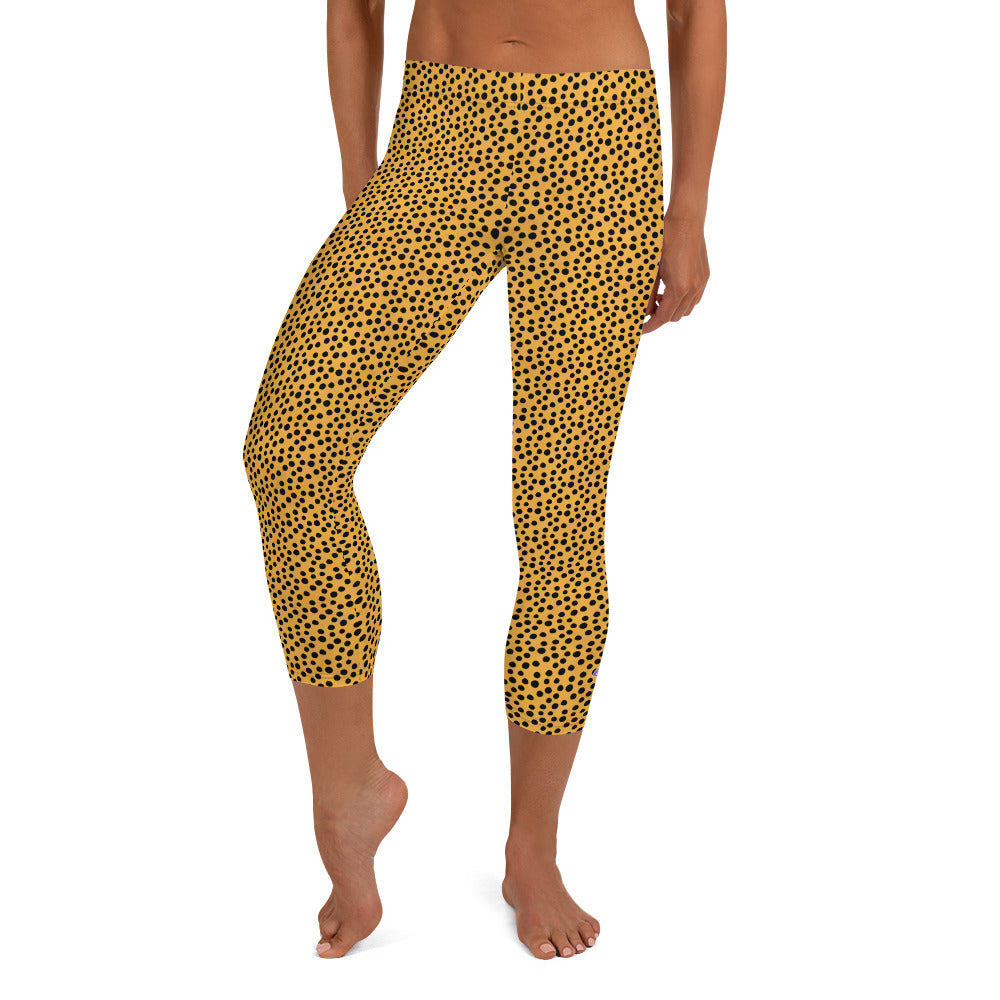 Kristin Zako embodies the "Wild & Free" spirit of her print capri leggings. These are printed in vivid color with a stylized cheetah print.  The words, "WILD & FREE" are down the right leg and you'll find Kristin's logo on the lower left leg. Cheetah style - Front view.