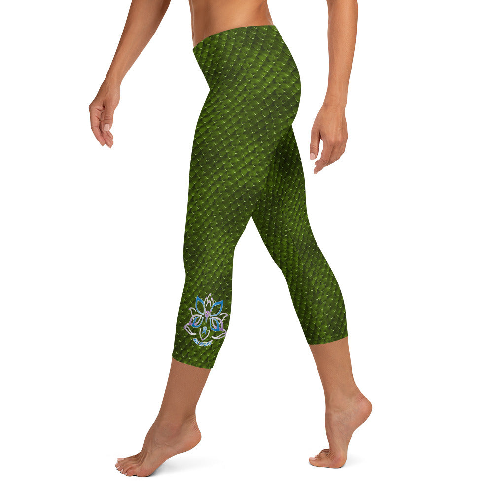 Kristin Zako embodies the "Wild & Free" spirit of her print capri leggings. These are printed in vivid color with a stylized cheetah print. The words, "WILD & FREE" are down the right leg and you'll find Kristin's logo on the lower left leg. Snake skin style - left view.