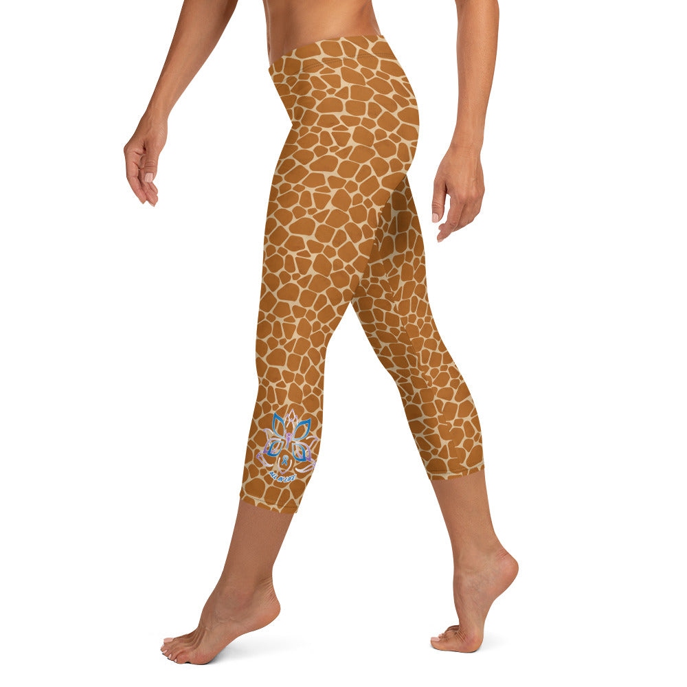 Kristin Zako embodies the "Wild & Free" spirit of her print capri leggings. These are printed in vivid color with a stylized cheetah print. The words, "WILD & FREE" are down the right leg and you'll find Kristin's logo on the lower left leg. Giraffe style - left view.