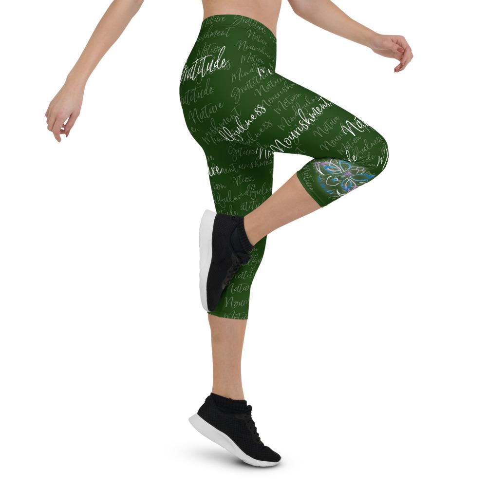 These Kristin Zako capri leggings are filled with her four pillars phrases and topped off with her logo on each side. They are super soft and comfortable. Shown in green, right view.