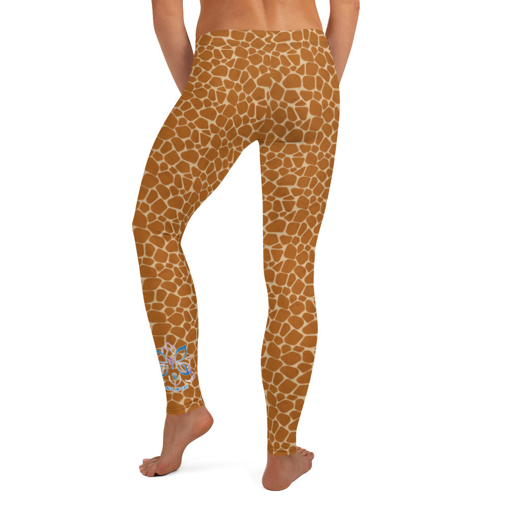Kristin Zako embodies the "Wild & Free" spirit of her giraffe print leggings. These are printed in vivid color with a stylized giraffe print.  The words, "WILD & FREE" are down the right leg and you'll find Kristin's logo on the lower left leg. Back view.
