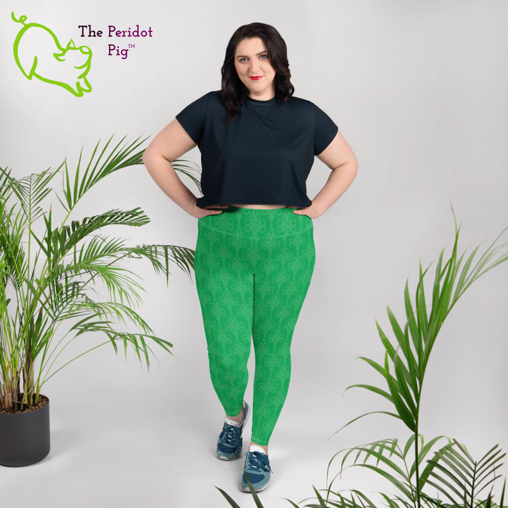Avoid the pinching on St Patrick's Day with a pair of bright green leggings! These leggings feature a shamrock Celtic-style knot pattern set on a bright kelly green background. Front view shown on a female model.