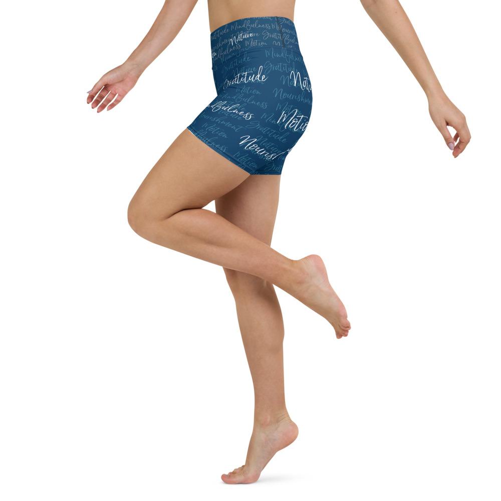 These yoga shorts have a body-flattering fit that will make you feel super comfortable even during the most intense workouts. They come with a high waistband and are made from soft microfiber yarn. The Kristin Zako print is filled with her four pillars phrases and topped off with her logo on the front right leg. Shown in blue. Left view.