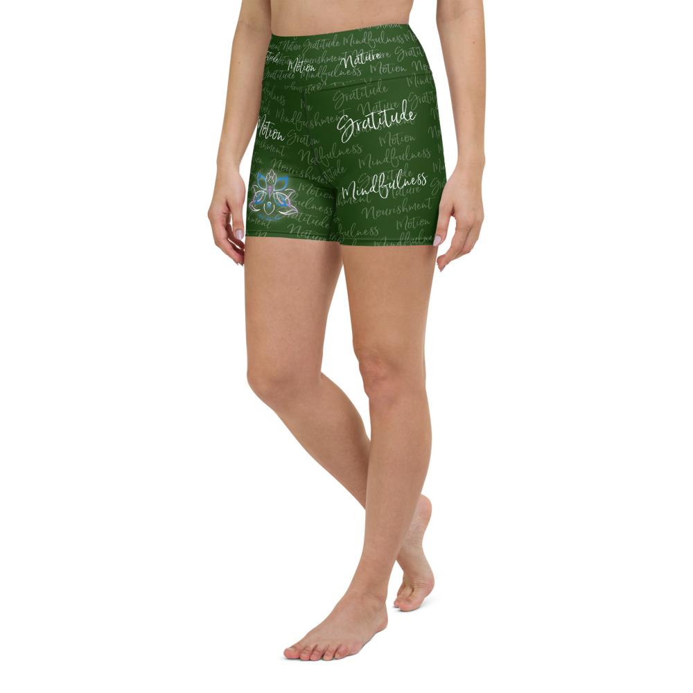 These yoga shorts have a body-flattering fit that will make you feel super comfortable even during the most intense workouts. They come with a high waistband and are made from soft microfiber yarn. The Kristin Zako print is filled with her four pillars phrases and topped off with her logo on the front right leg. Shown in green. Left view.