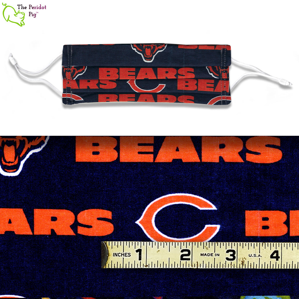 A view showing the mask and the scale of the pattern. Da Bears is an orange and blue fabric pattern with Bear logos and text.