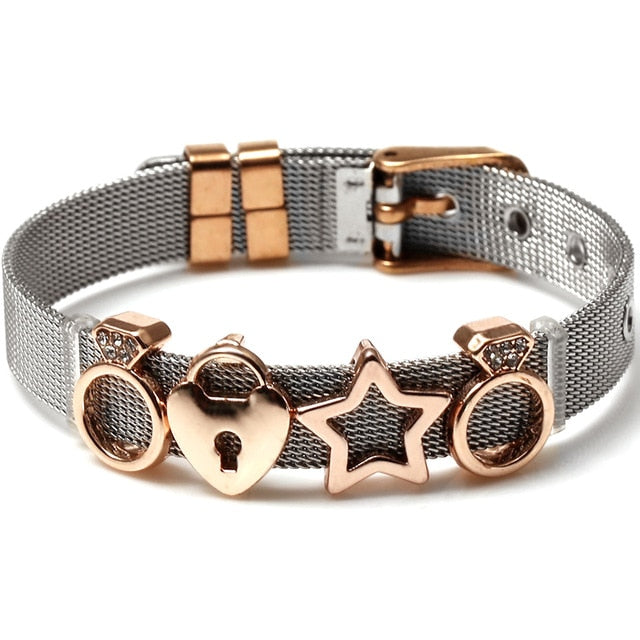 These mesh bracelets are cute enough to make "squeee" noises. They come with a variety of charms that come in different metal colors. There are hearts, rings, stars, ladybugs, unicorns and lots of glam! Stainless bracelet with rose gold charms.