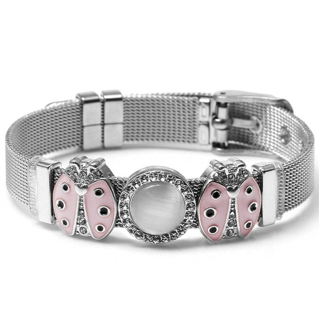 These mesh bracelets are cute enough to make "squeee" noises. They come with a variety of charms that come in different metal colors. There are hearts, rings, stars, ladybugs, unicorns and lots of glam! Stainless bracelet with pink and silver ladybug charms.
