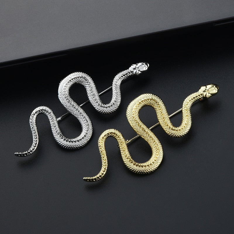 Image of An elegant snake pin measuring at 3" in length. shown in both gold and silver finishes.