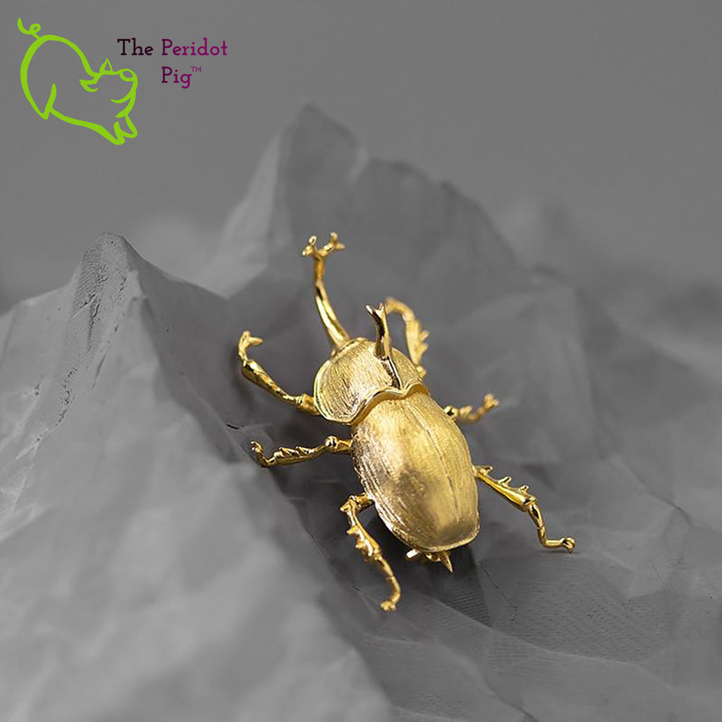 The detail on this amazing iNature rhinoceros beetle brooch is wonderful. Cast in 925 sterling silver and plated in 18K gold. Shown in gold, front view.